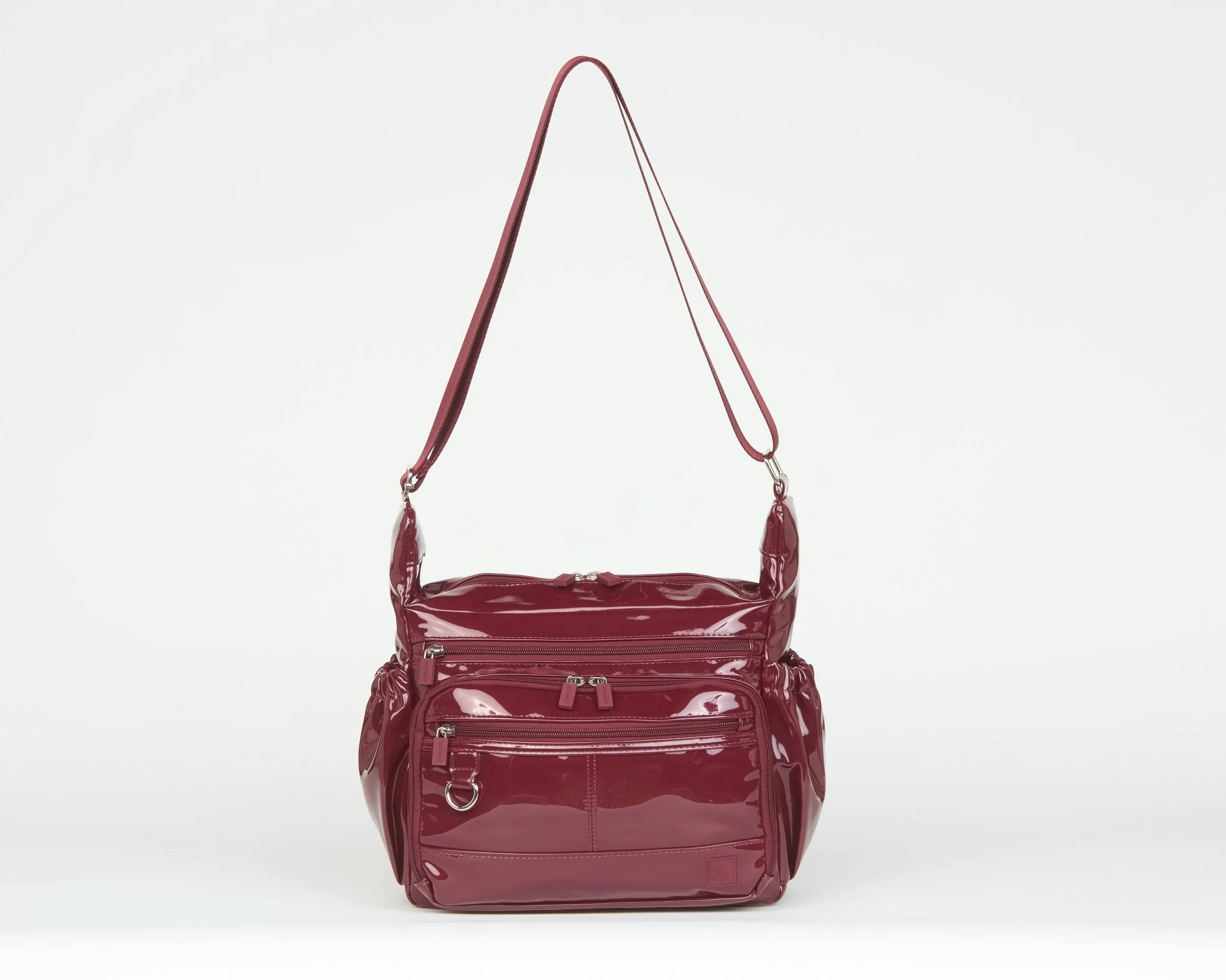 THE EVERYDAY EXPLORER MESSENGER CROSSBODY - PATENT MERLOT