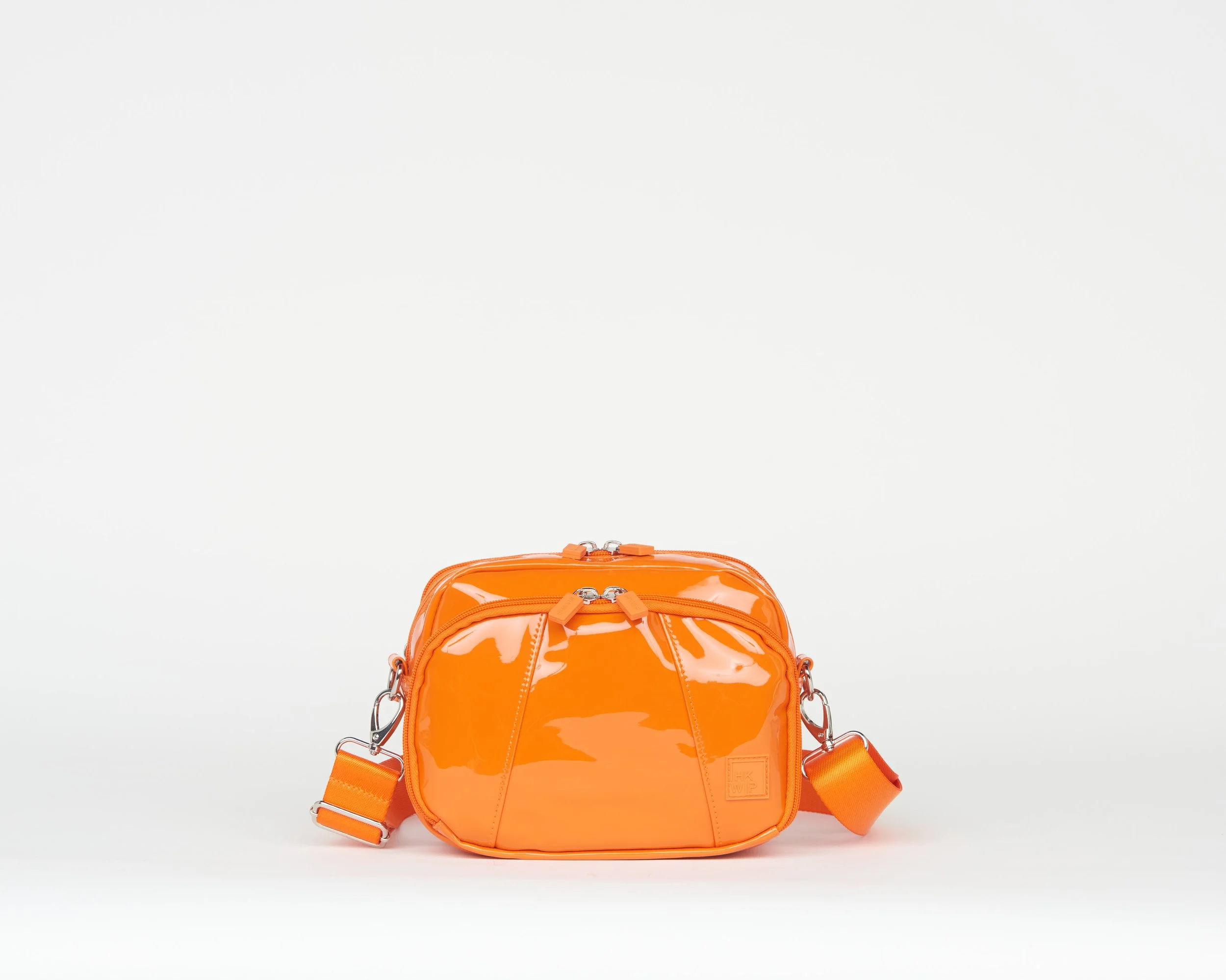 THE MODERN MOMENT CROSSBODY - PATENT CARROT