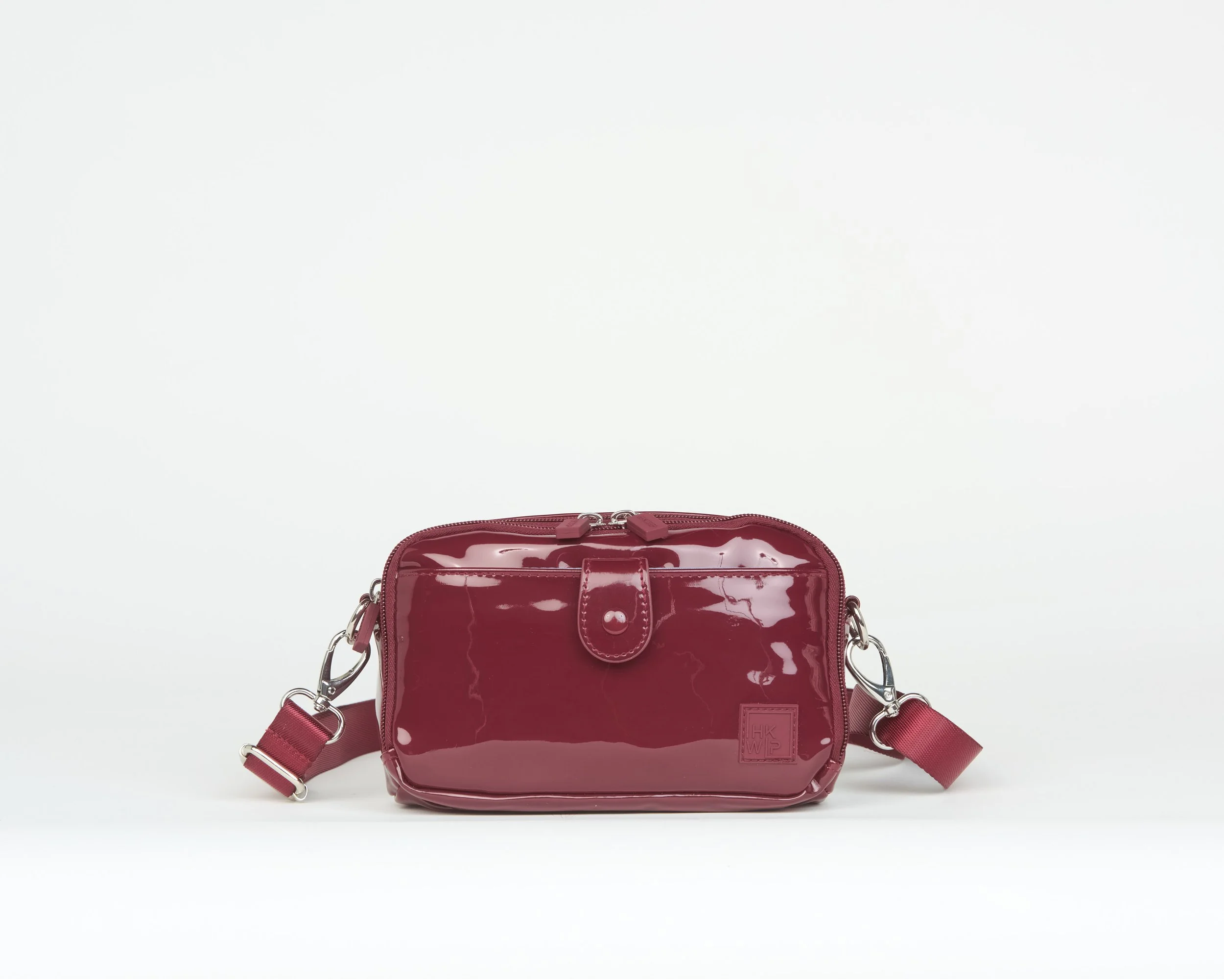 THE EAST/WEST SNAP IT CROSSBODY - PATENT MERLOT