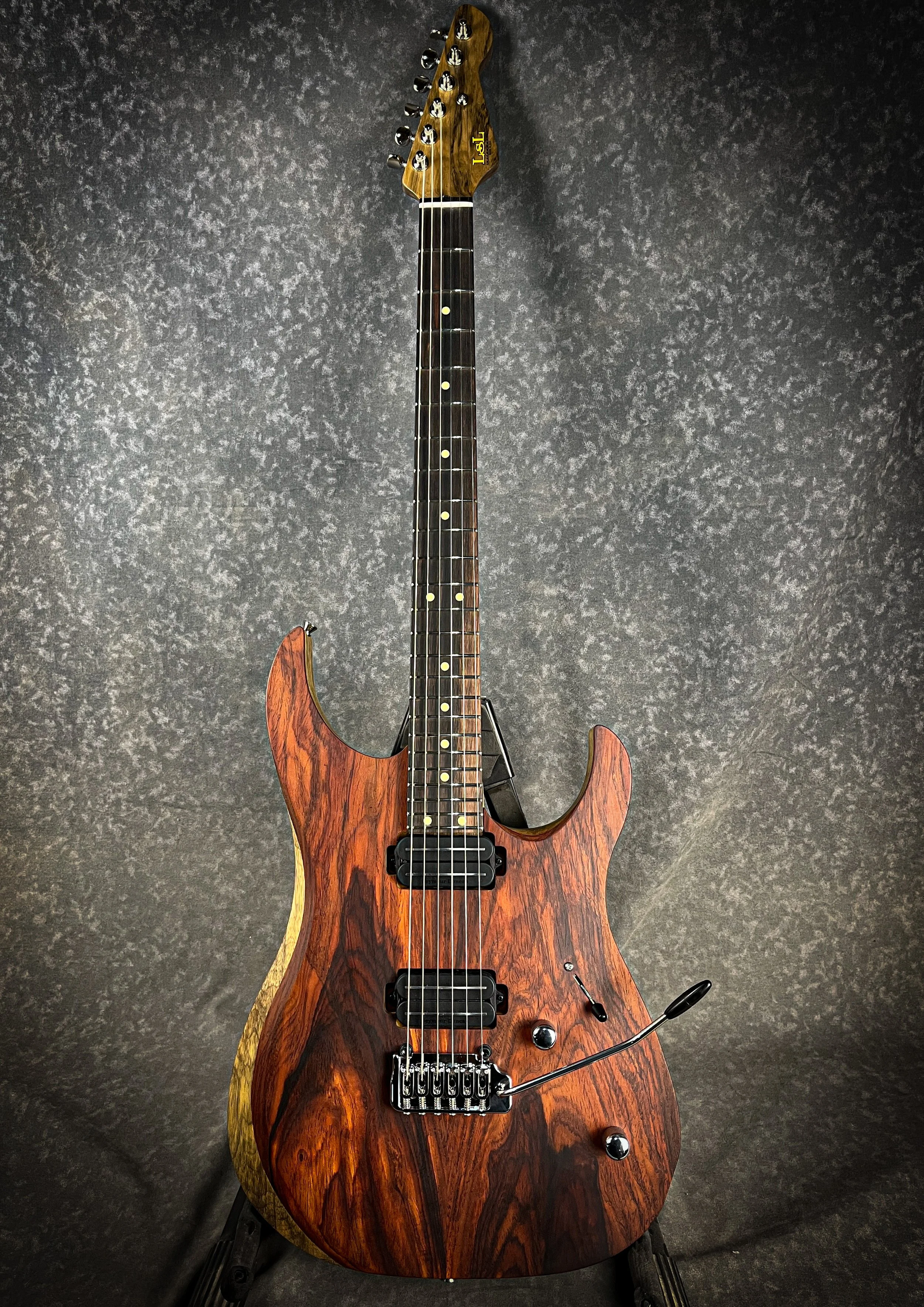 LSL Instruments XT models are modern super s style guitars with 22 or 24 frets and loads of exotic upgrade options. Cocobolo and black Limba, mahogany, quilted maple and custom finishes are common. Ebony or pale moon ebony  or macassar ebony availabl
