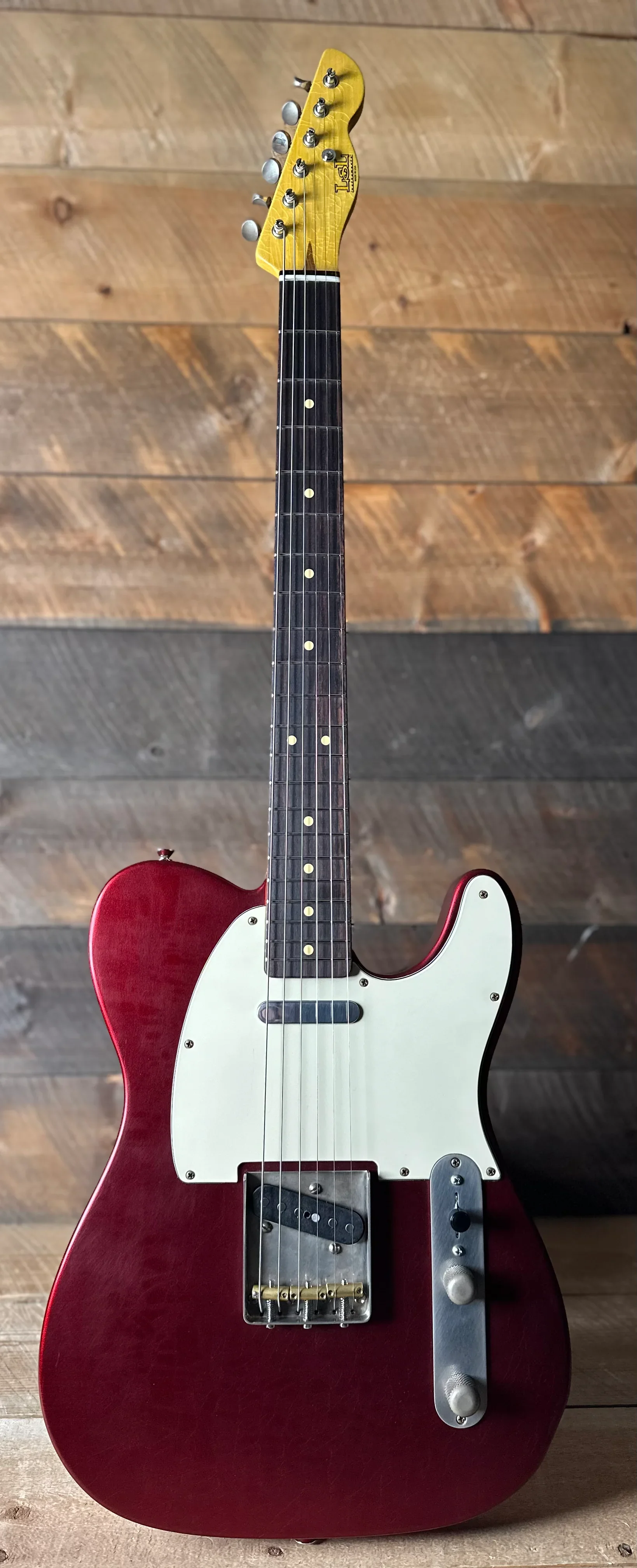 Chris Fleming Series by LSL Instruments. T bone Candy Apple Red with rosewood  board. Sold By Premier Dealer Quimper Sound