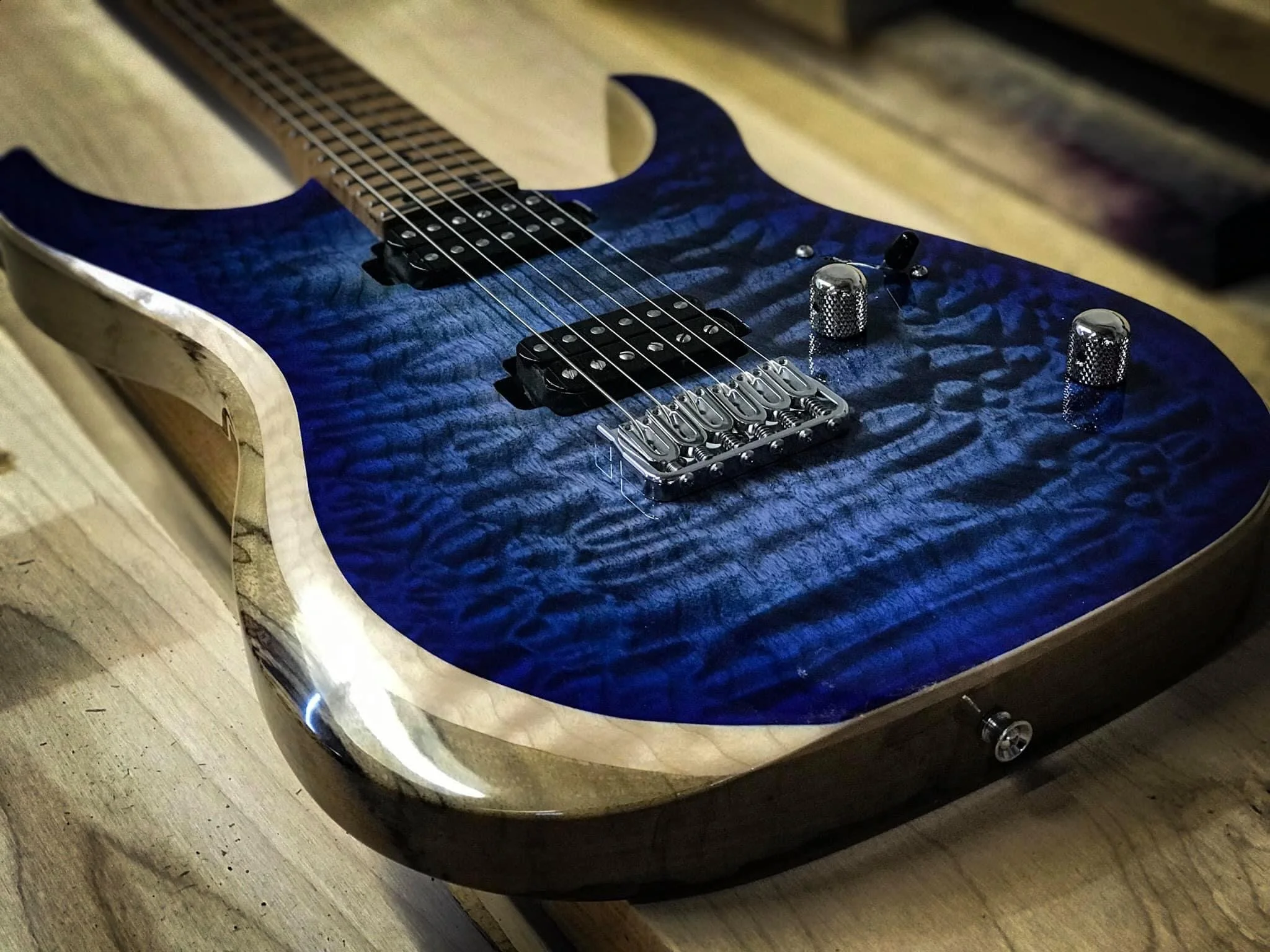 Custom blue color quilted maple black limba mega build by lsl instruments xt4dx with modern beveled contour
