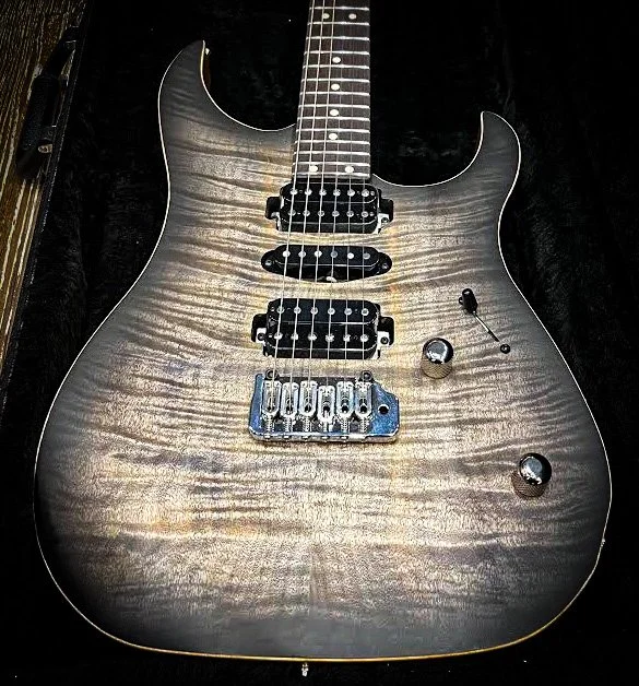 XT4DX by lsl instruments with flame top and trans charcoal finish
