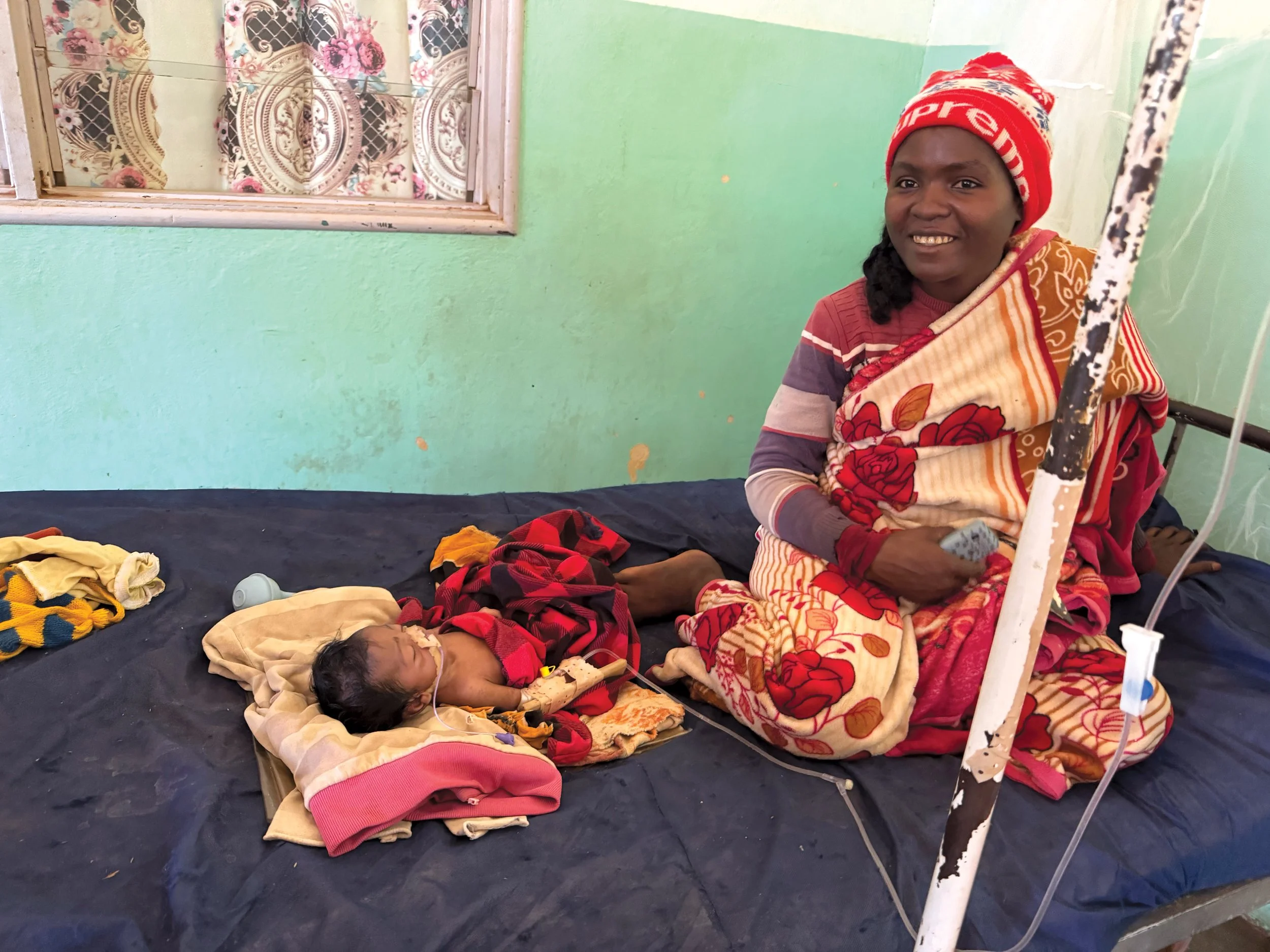   At Ejeda Hospital, a mother and her newborn, who was born with feeding difficulties, receives care.  