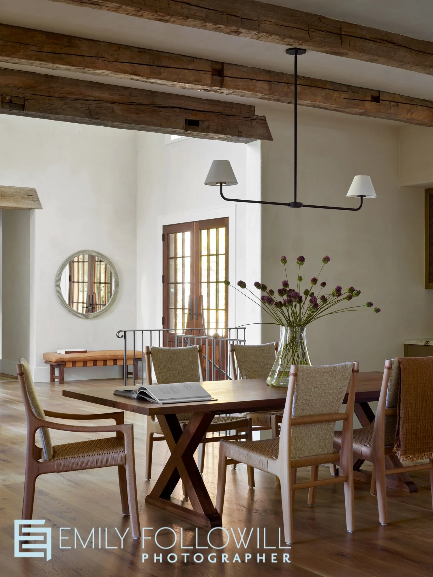 Beautiful dining table that is open tot he main entry and living room in this Lake Burton vacation home. Designed by The Design Atlelier