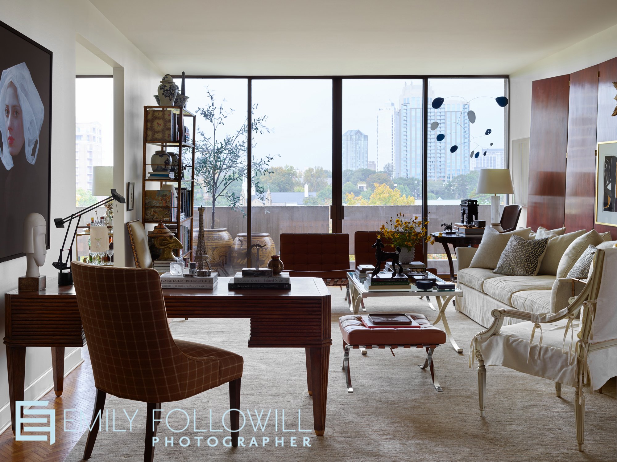 sophisticated flat in Plaza Towers, located in Buckhead Georgia. The large living room windows provide a stunning view of Atlanta skyscrapers. Designed by the late Keith Arnold.