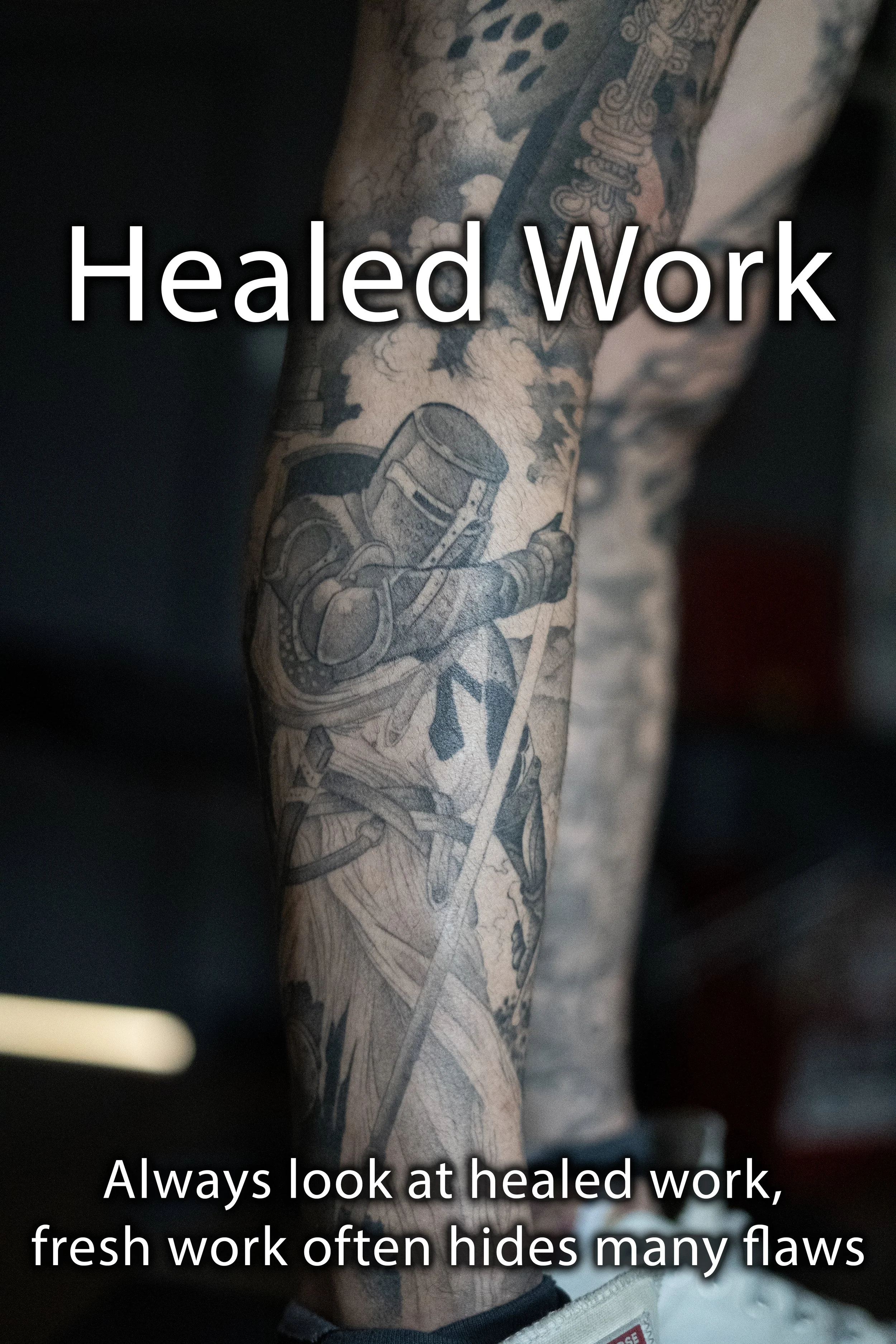 Close-up of a tattooed leg with a black and gray tattoo of a knight in armor holding a sword, with text overlay saying "Healed Work" and a caption stating, "Always look at healed work, fresh work often hides many flaws." Brian Foster