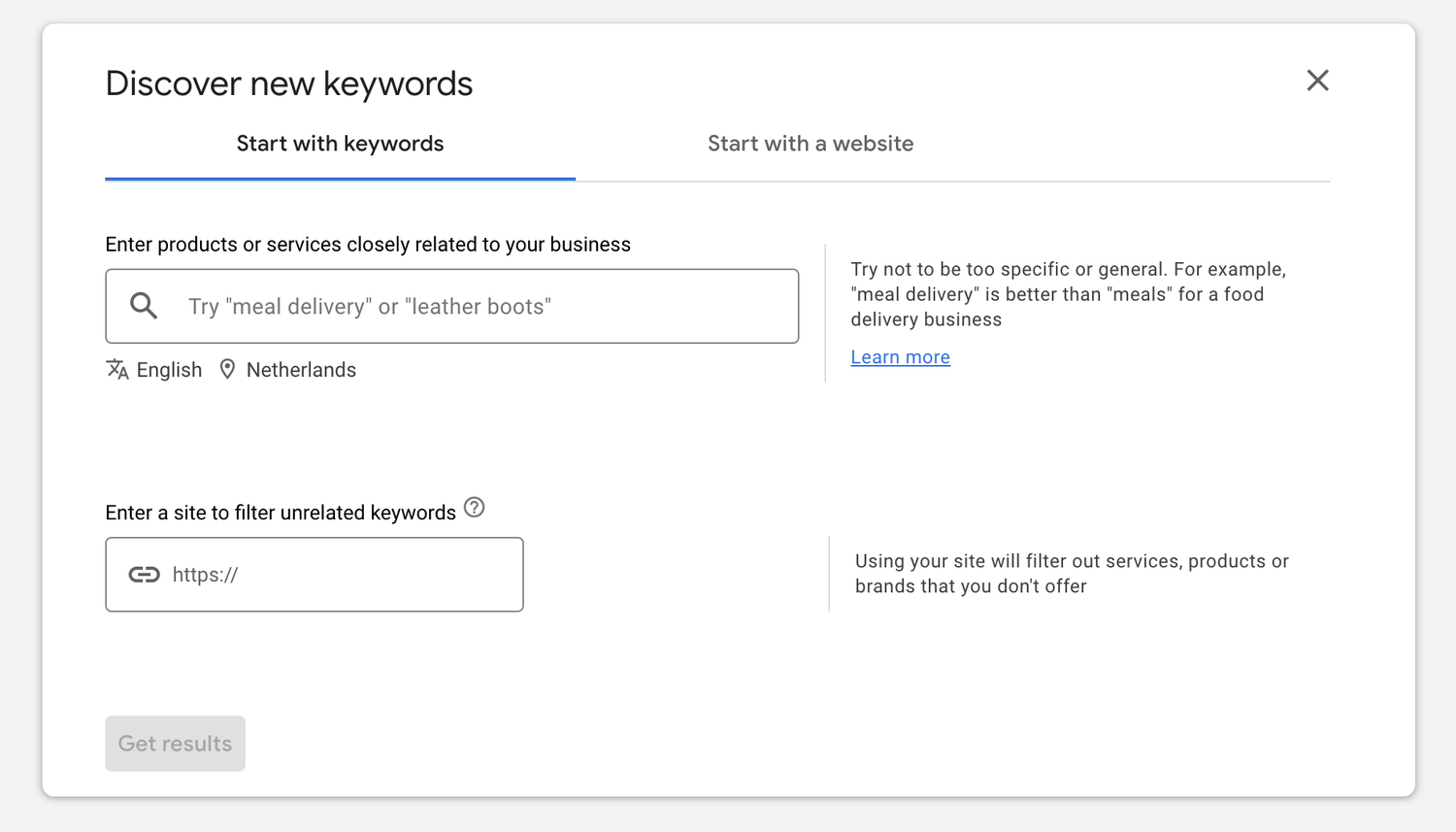 A screenshot of a Google Ads interface for discovering new keywords, showing options to start with keywords or a website, with search field and 'Learn more' link.