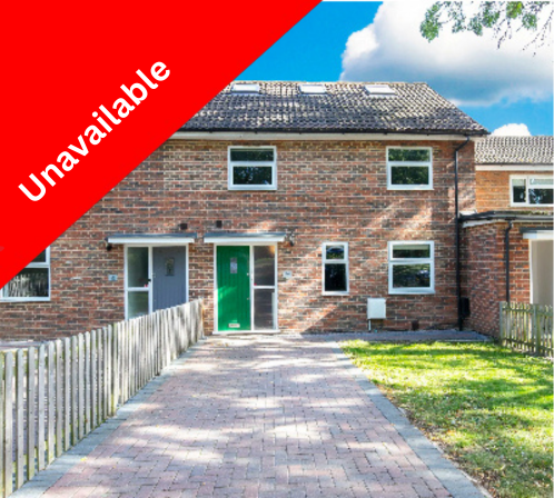 Brick house with a green front door, small windows, a paved driveway, a wooden fence on the left, and a lawn on the right, under a blue sky with clouds, with an 'Under Offer' banner in red and white.