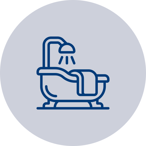 Icon of a bathtub with a showerhead overhead and a towel draped over the side