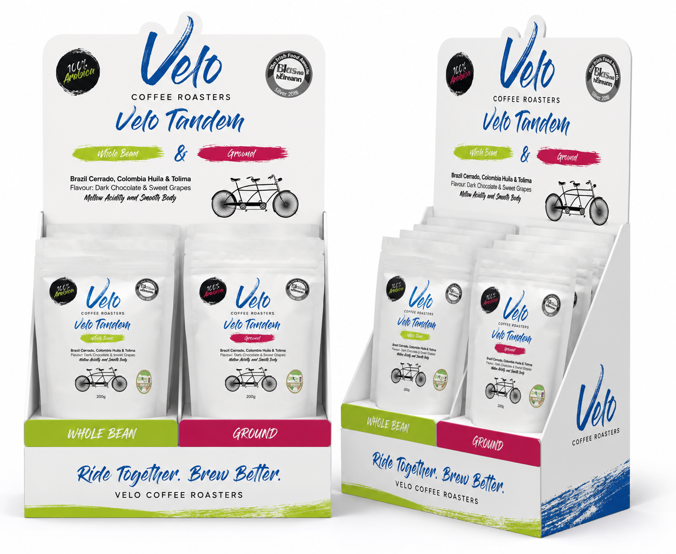 Display stand of Velo Tandem coffee roasters with bags of whole bean and ground coffee, featuring a tandem bicycle illustration, with text indicating flavor and roast type, and a slogan 'Ride Together. Brew Better.'