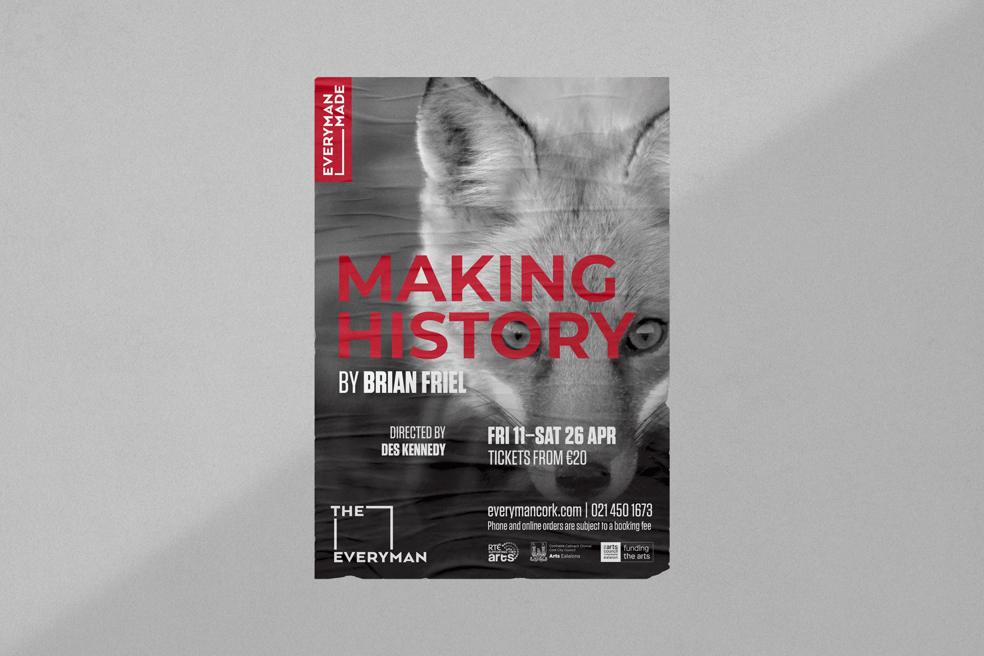 Poster for the play "Making History" by Brian Friel, directed by Des Kennedy, showing a close-up of a cat's face in grayscale with red text overlay, and information about the show dates and ticket prices.