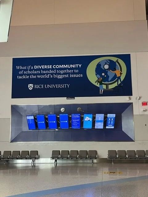 Ad above flight information board.