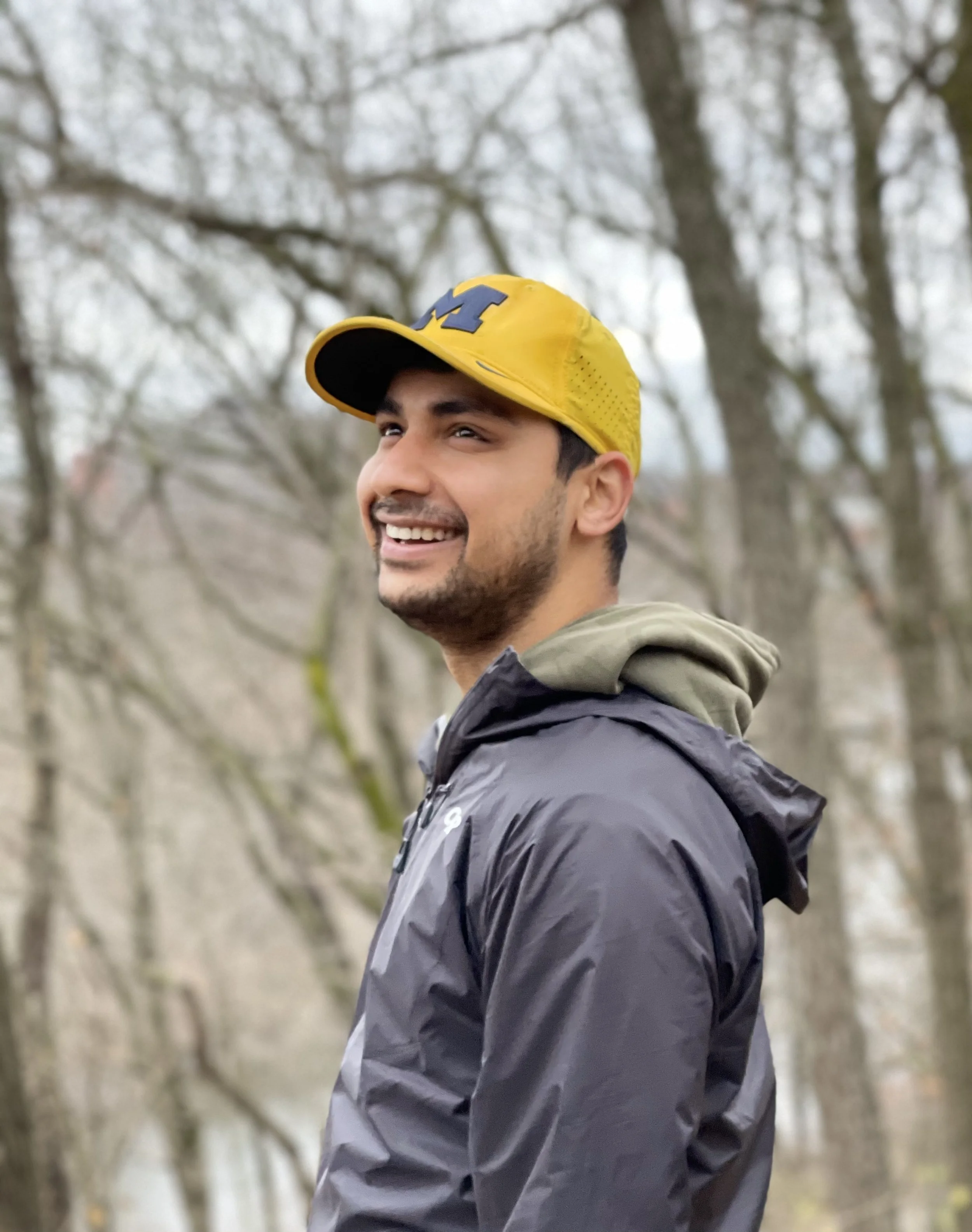 Image of author wearing yellow cap and black rain jacket