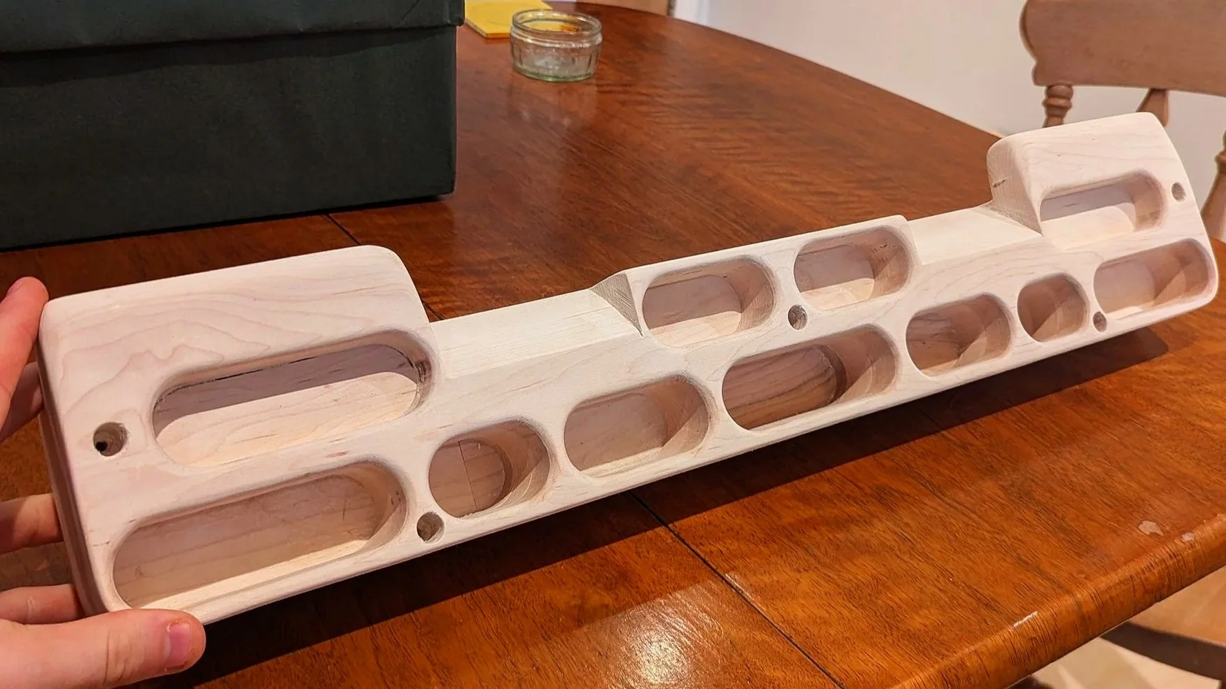 Maple Hang-board with varying depth finger holds.