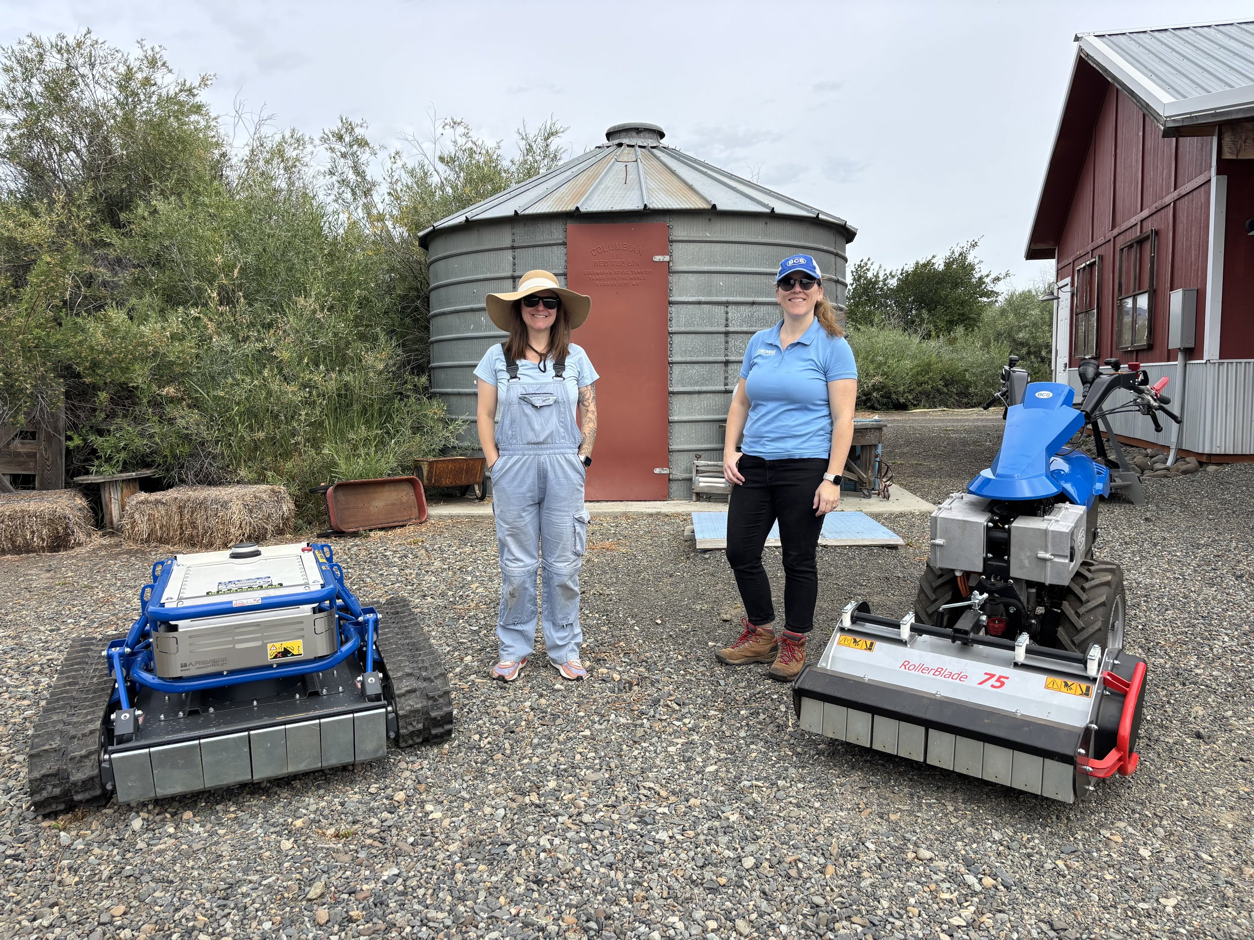  &nbsp;BCS representatives, Kara Thompson and Charlotte LeMieux, standing in front of the TracMow remote-control slope mower (left) and the e-780 prototype two-wheel tractor with RollerBlade Flail Mower attachment. Photo credit Maia Gutmann.  