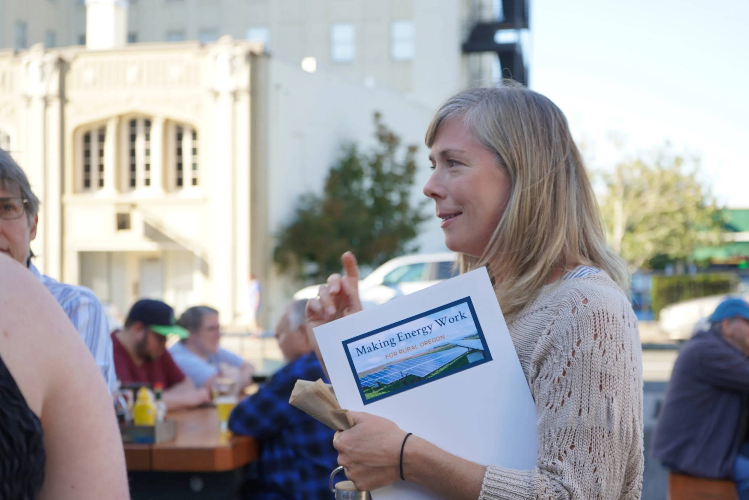 Attendee sharing reflections during the wrap-up exercise in the courtyard.jpg