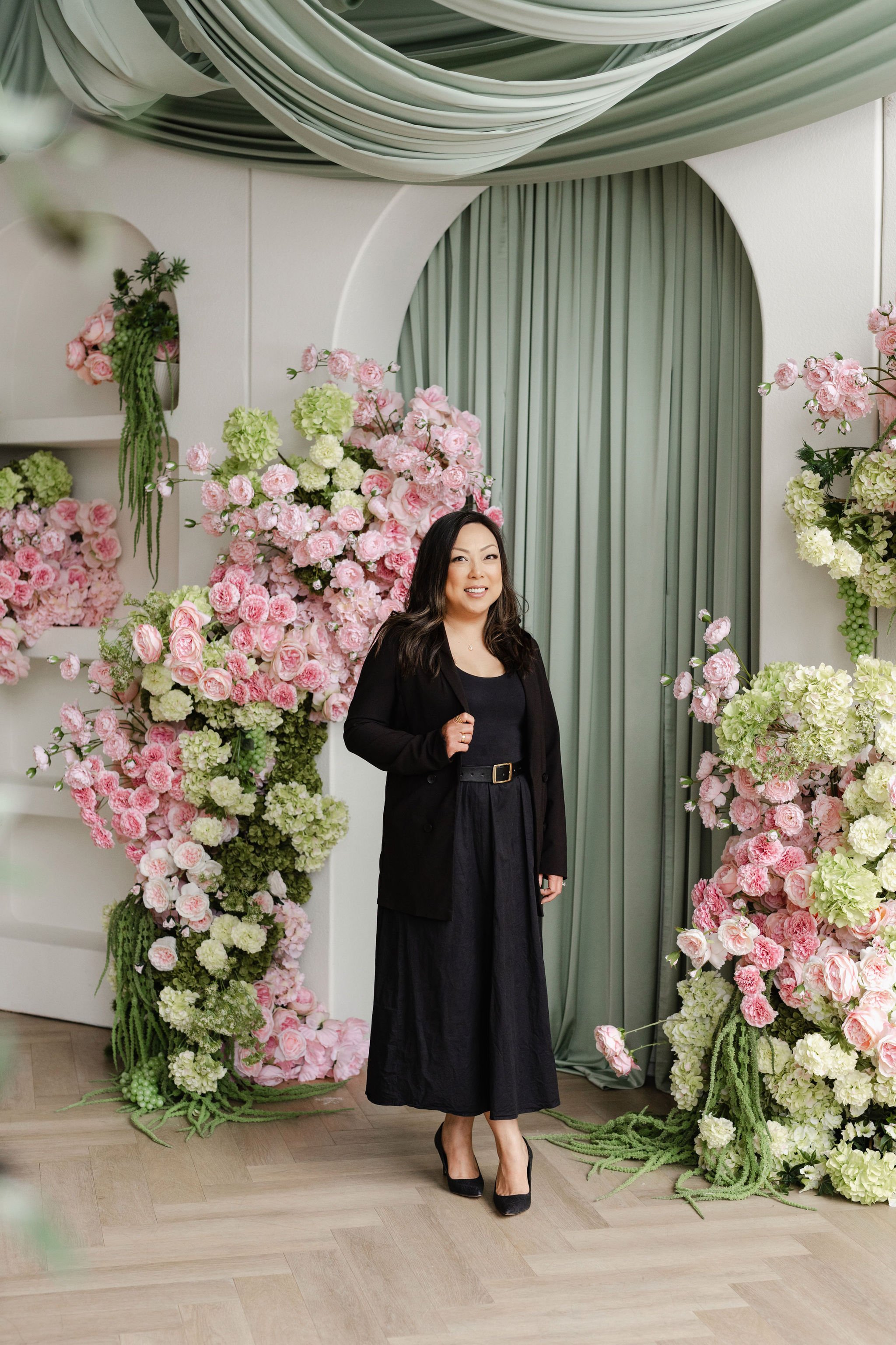 Jennifer is arranging a table with wine glasses and candles
