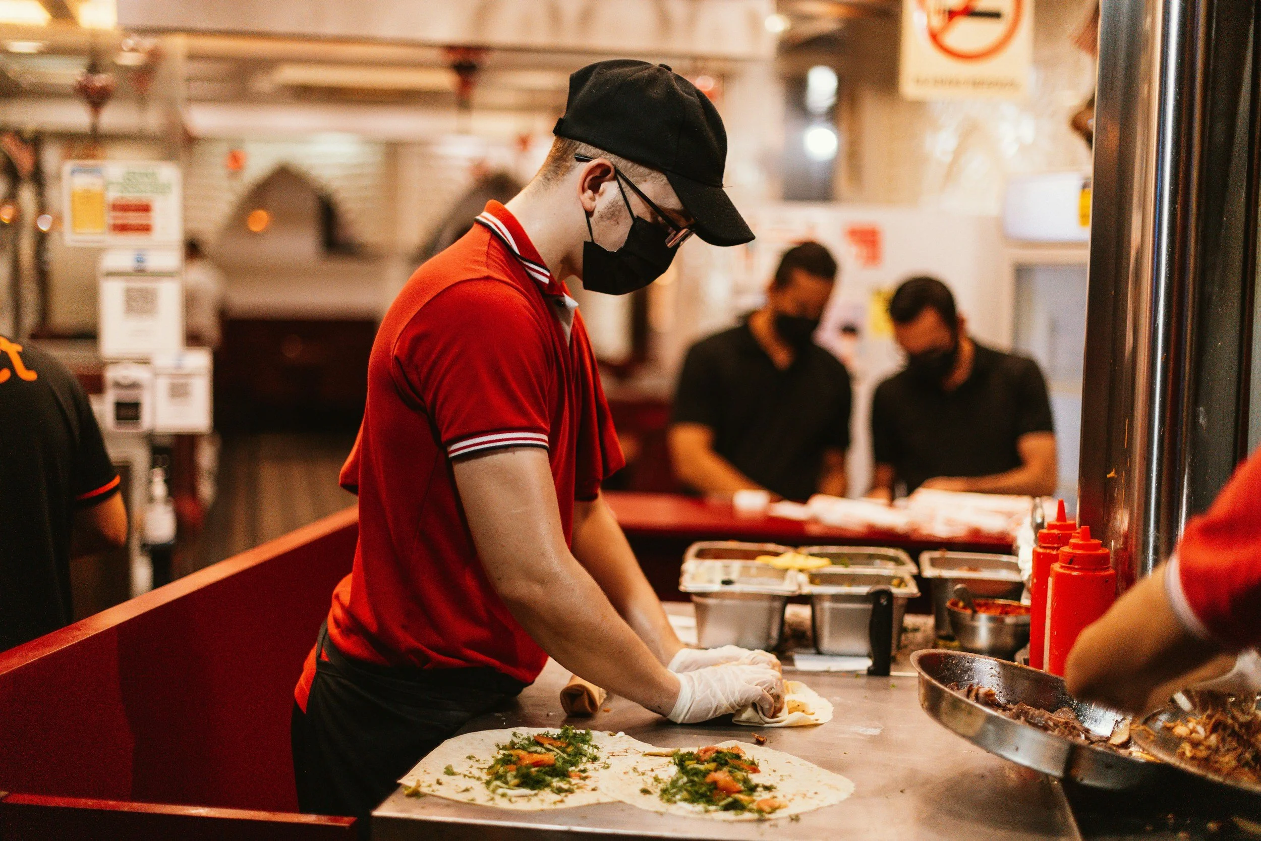 Restaurant team preparing food in a commercial kitchen
