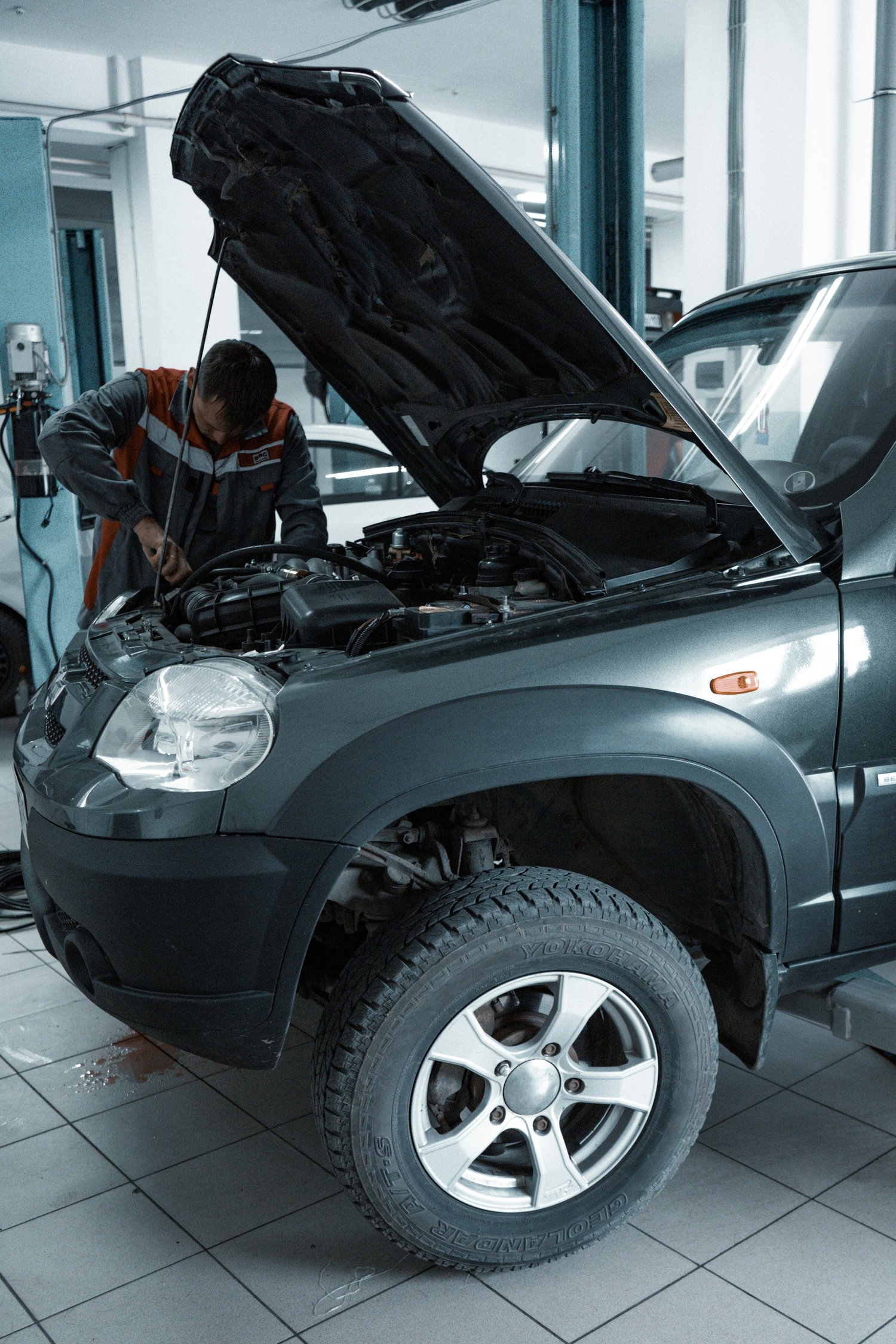 Automotive professional working inside a repair shop