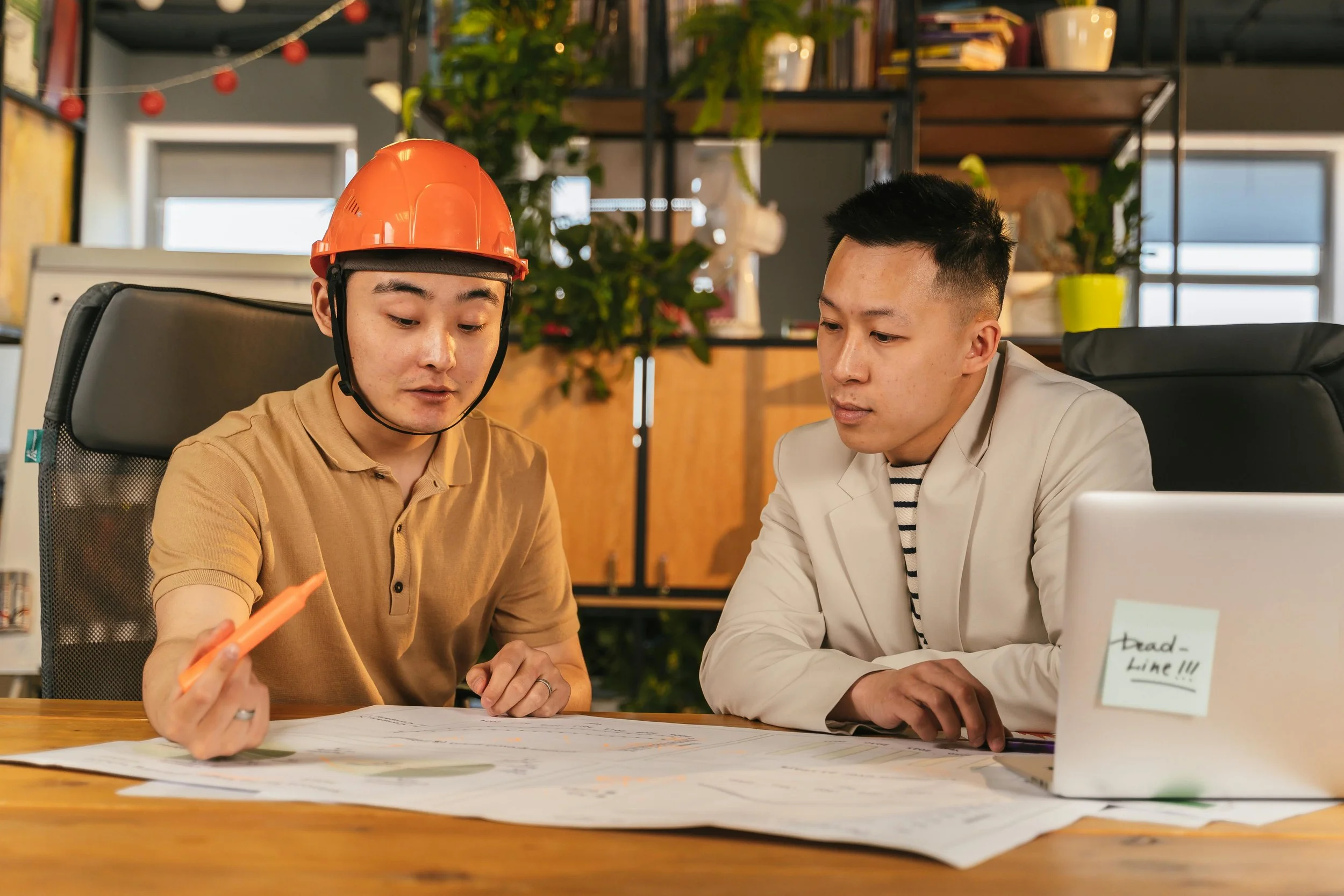 Construction professionals reviewing plans together