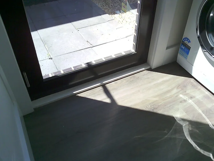 Water pooling on a balcony checked for leaks