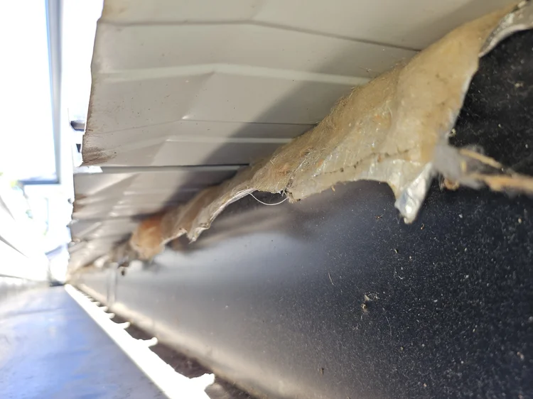 Failed waterproofing membrane at a roof edge