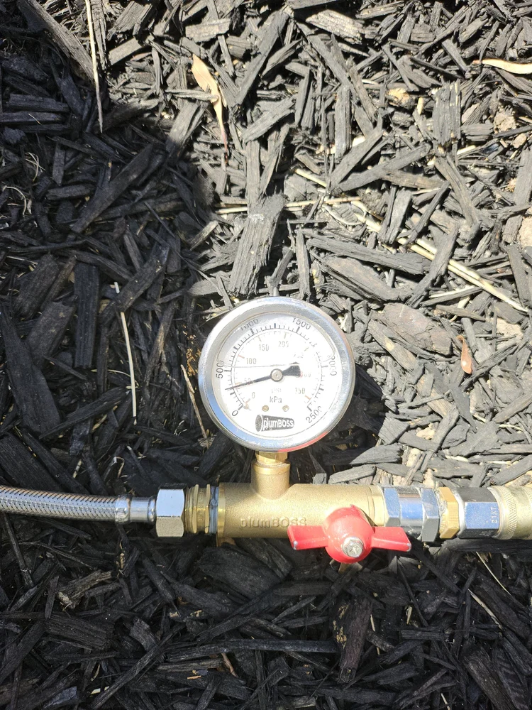Pressure test gauge fitted to a water line