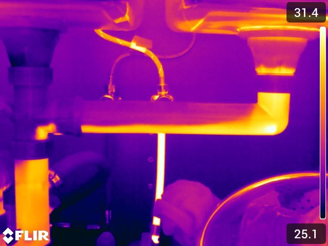 Thermal image of a hot water pipe leaking under a sink