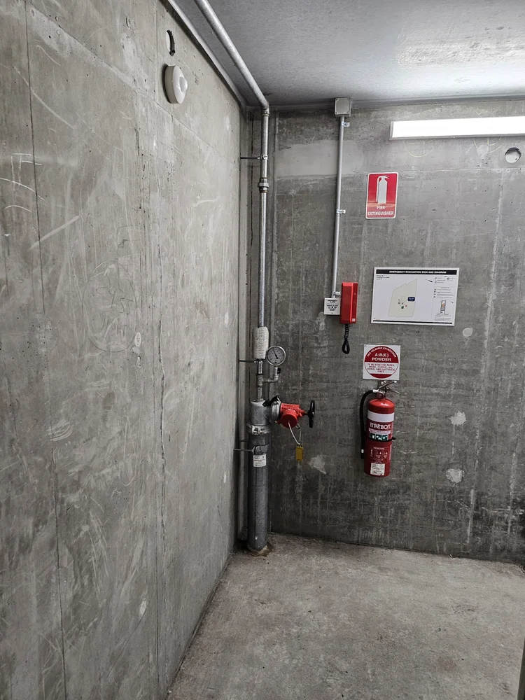 Fire hydrant riser checked for leaks in an apartment building