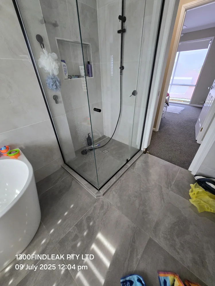 Frameless glass shower tested for a leak