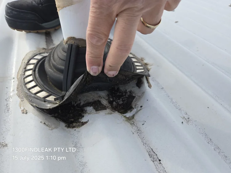 Roof pipe penetration boot checked for a roof leak