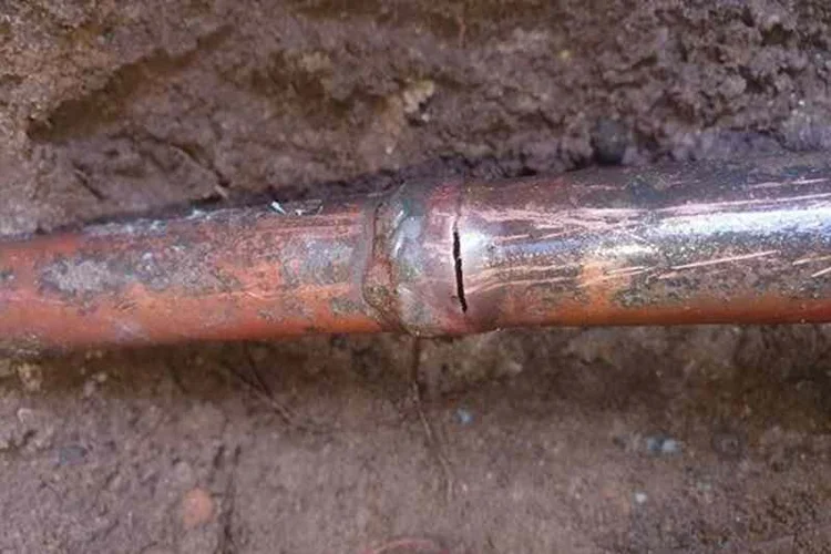 Corroded copper pipe close-up after a pipe burst