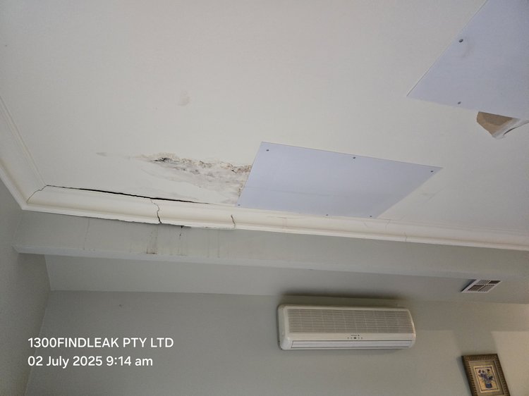 Water-stained ceiling below a burst pipe