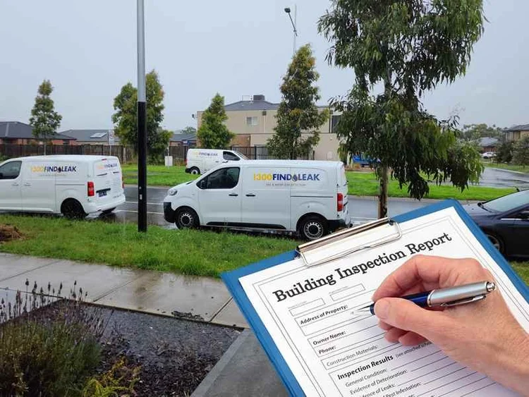 Gas leak detection report being completed beside a 1300 FINDLEAK van