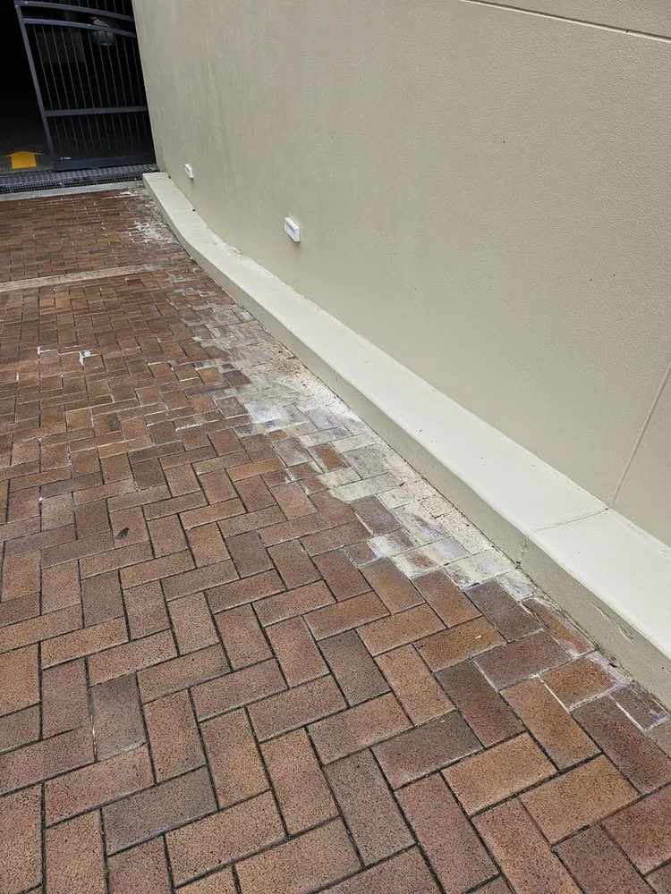 Efflorescence on a tiled balcony caused by water getting under the tiles