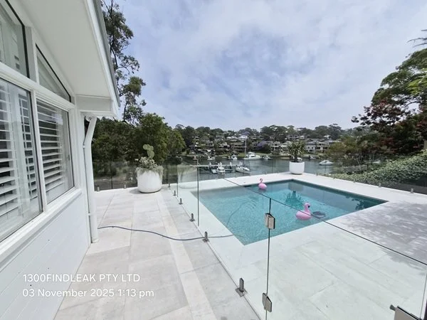 A professional leak detection insurance report displayed on a tablet, featuring thermal evidence and expert analysis for a prestige property sale.