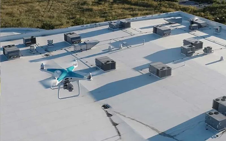 Drone inspection over a flat commercial roof