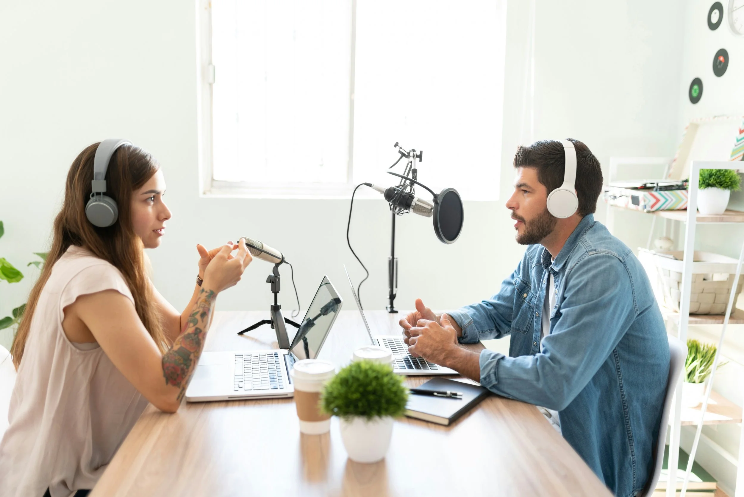 man and woman recording podcast episode | tips from longest running podcasts