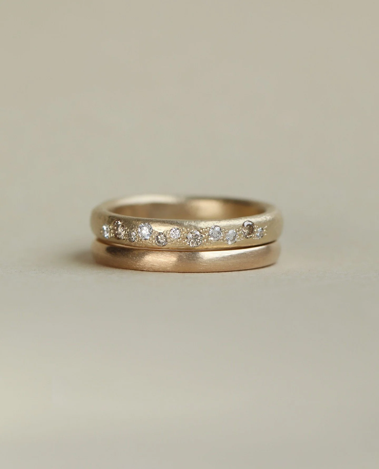 A real love story, cast in gold. ✨⁠
⁠
This bespoke wedding stack was custom made for one of our lovely couples, featuring a scatter of brilliant diamonds nestled into our signature textured gold scatter band.⁠
⁠
While this exact set belongs to its fo