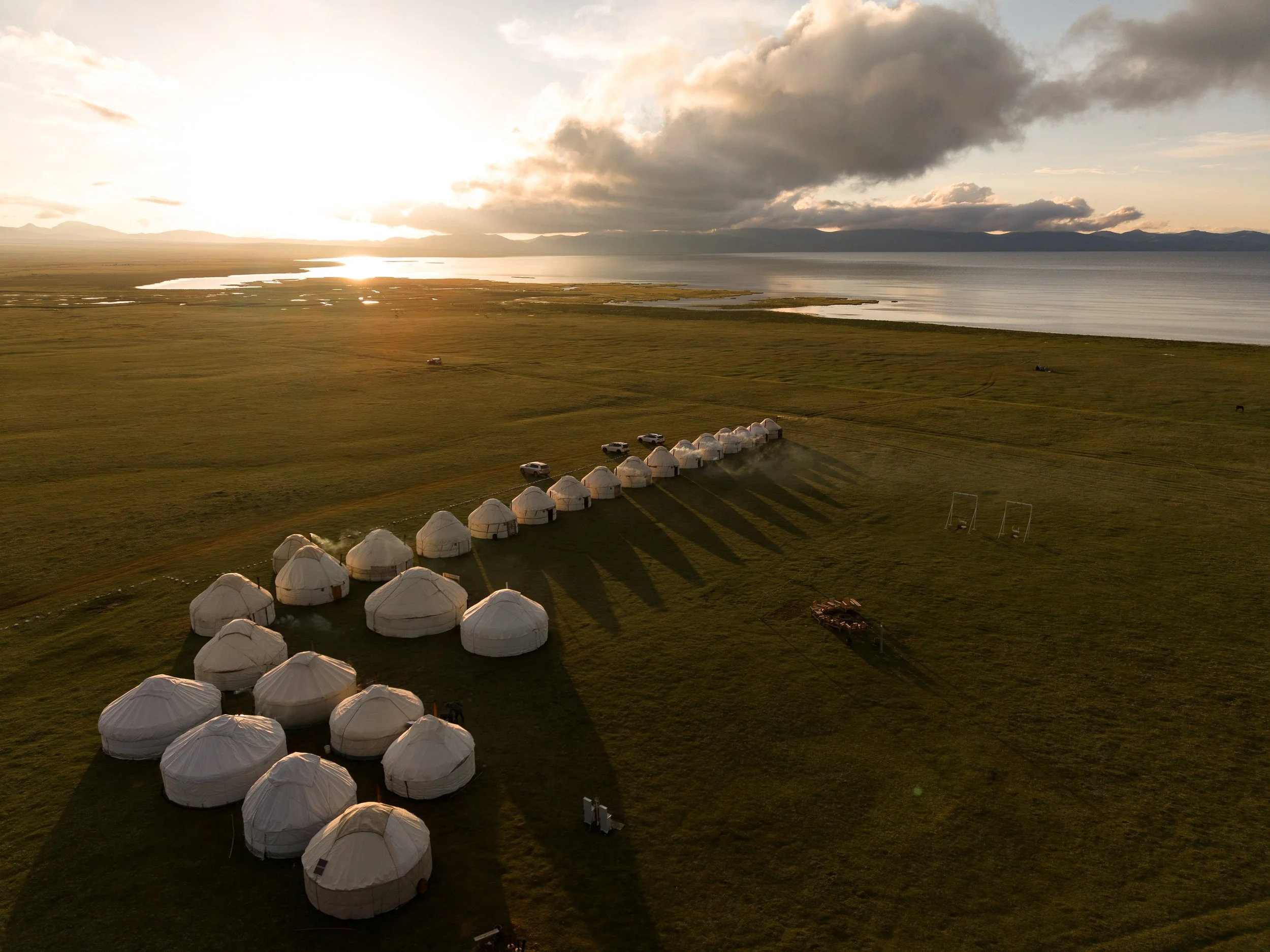 Sunset over Traditional yurts  at Song-Kul Lake in Kyrgyzstan