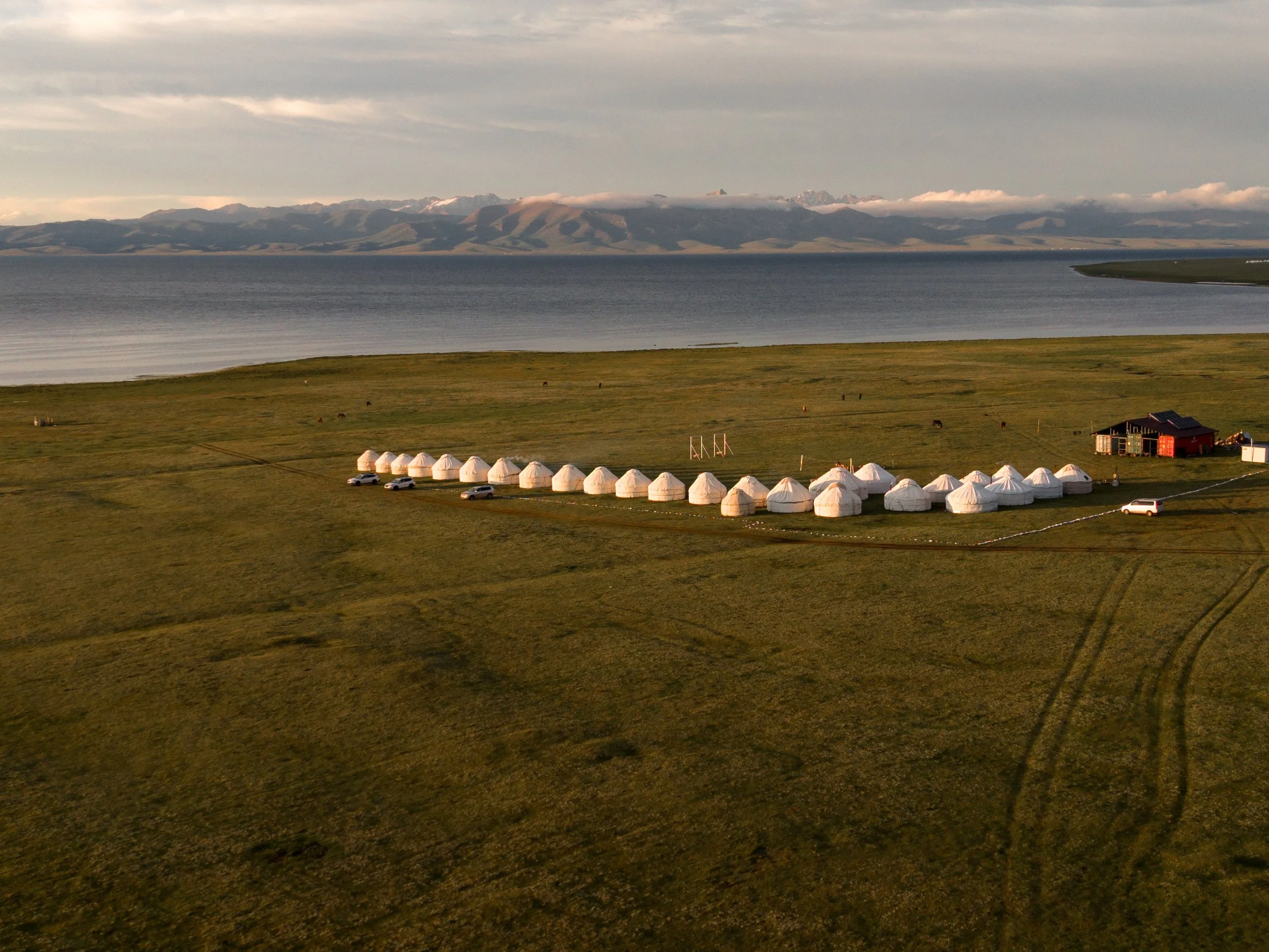 Sunset over Traditional yurts  at Song-Kul Lake in Kyrgyzstan