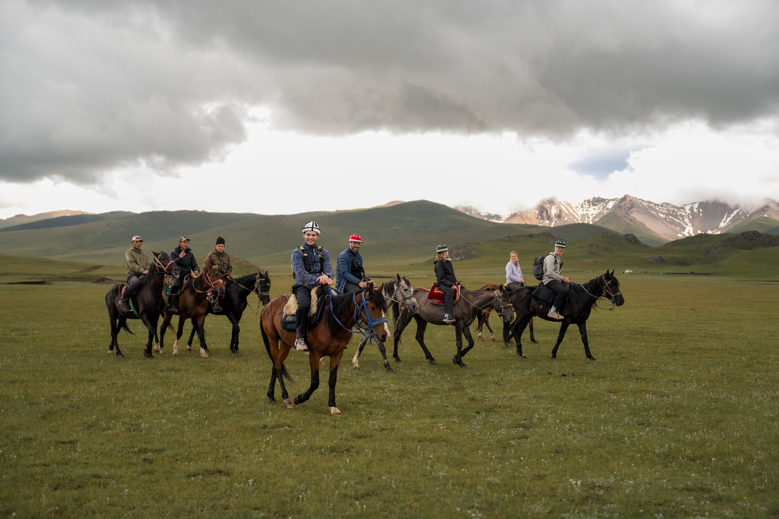 Horseriding across the Song-Kul steppe in Kyrgyzstan