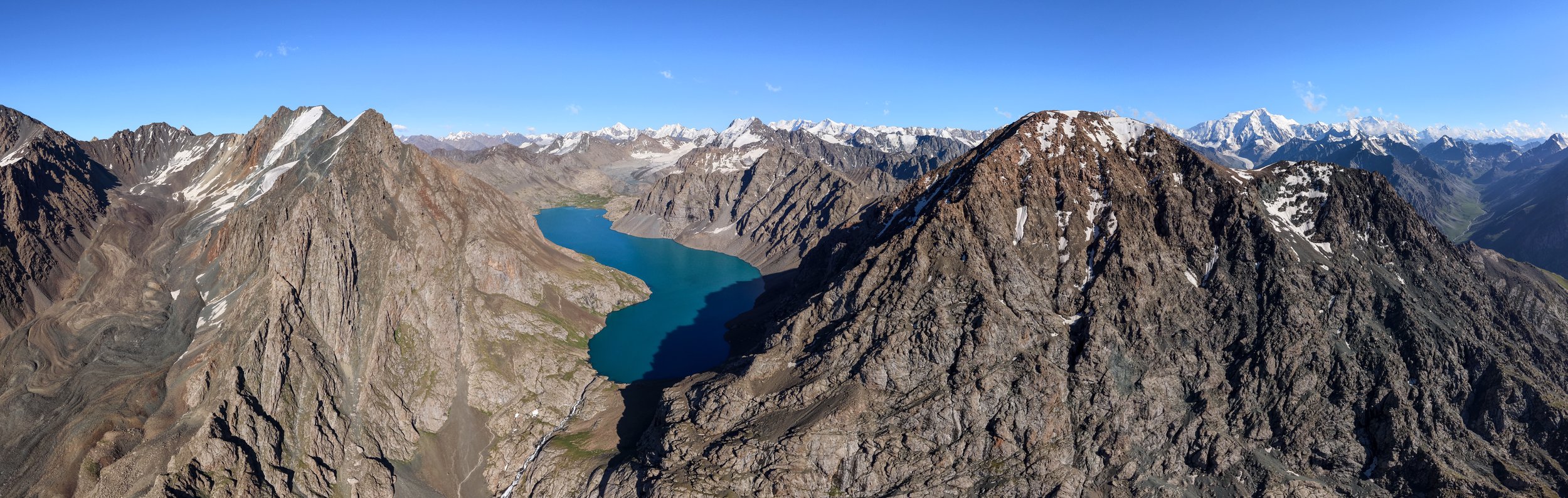 Turquoise waters of Ala-Köl Lake in Kyrgyzstan