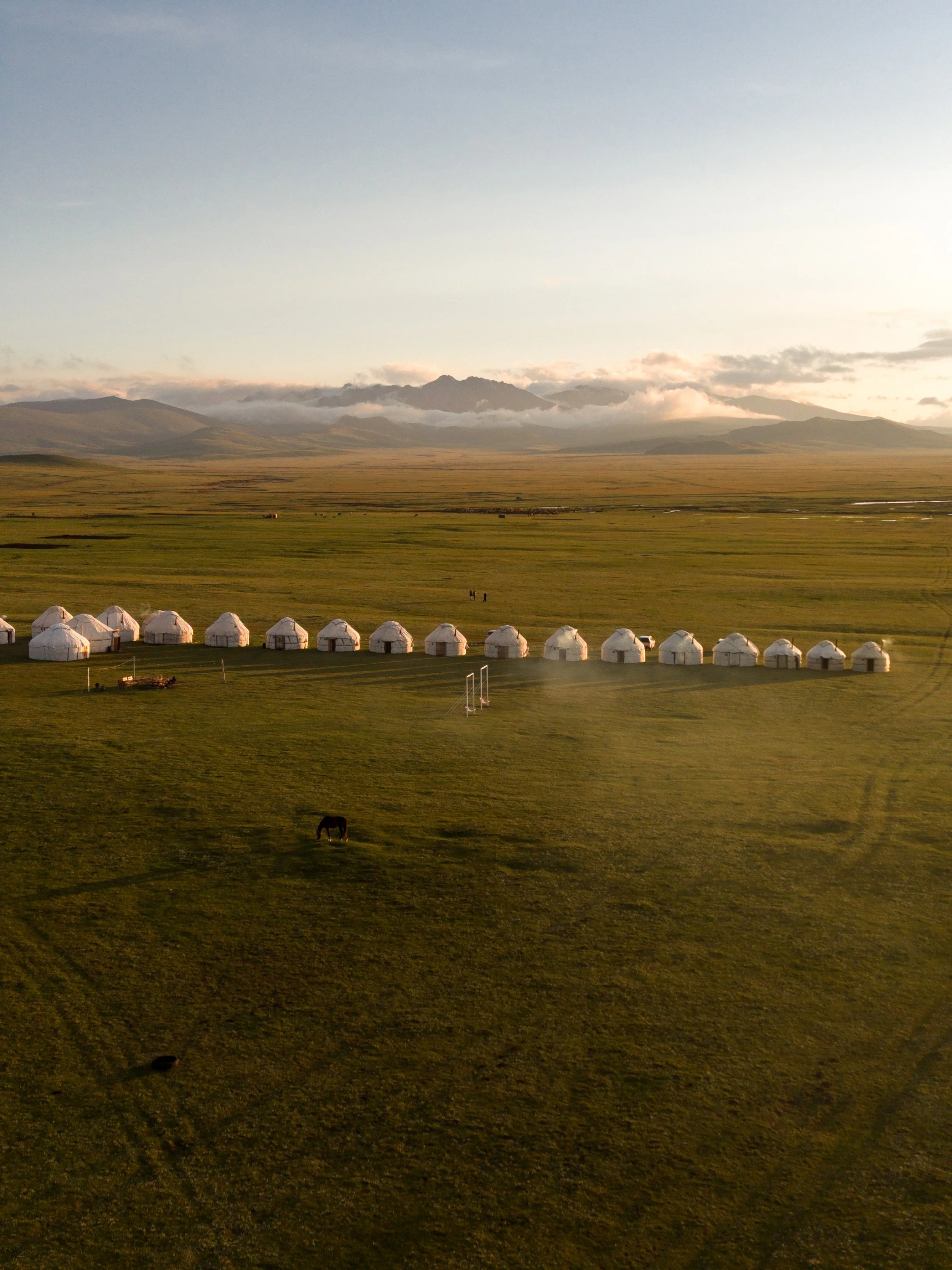 Sunset over Traditional yurts  at Song-Kul Lake in Kyrgyzstan