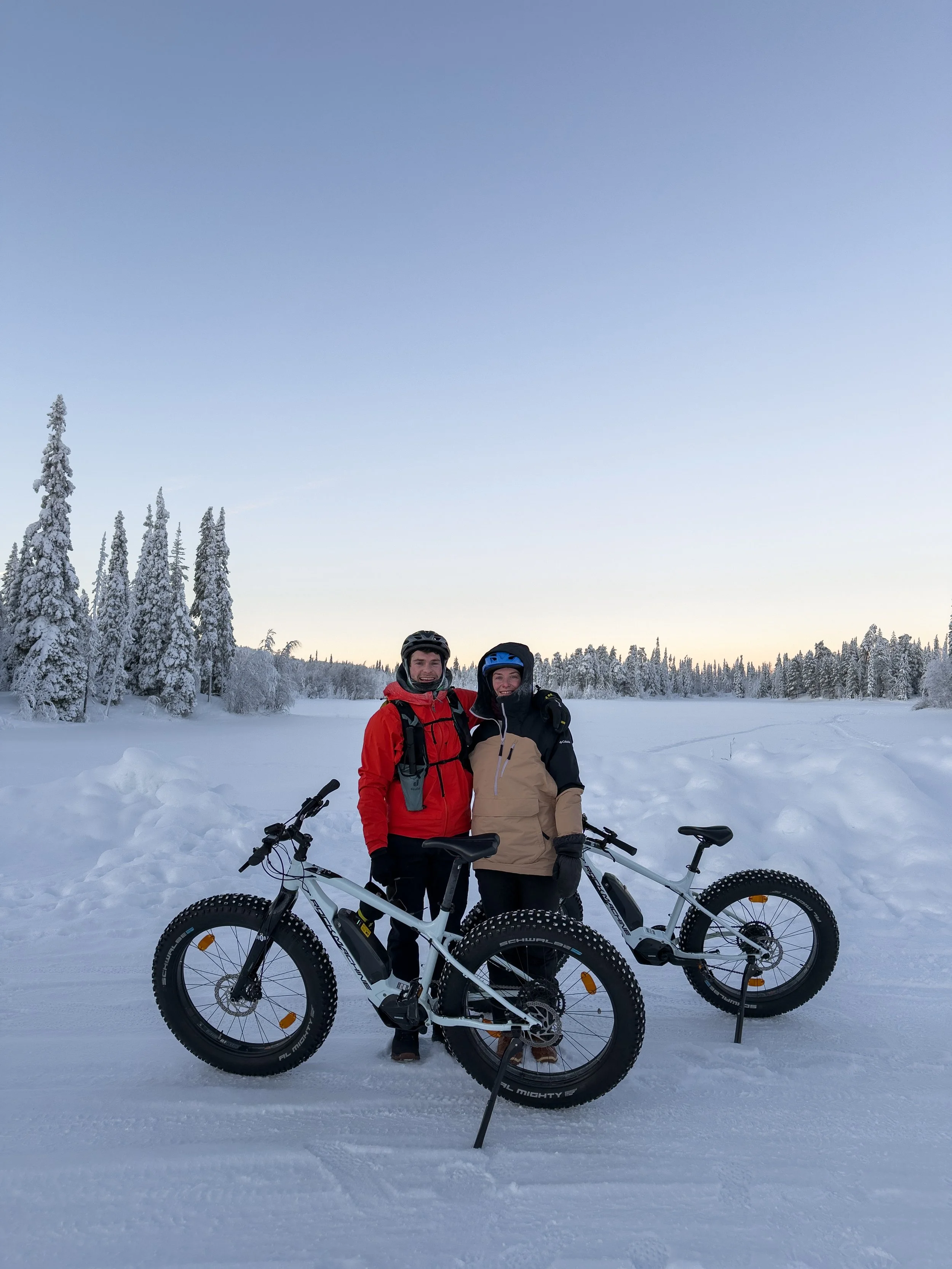 E-biking in a snow covered forest in Finnish Lapland