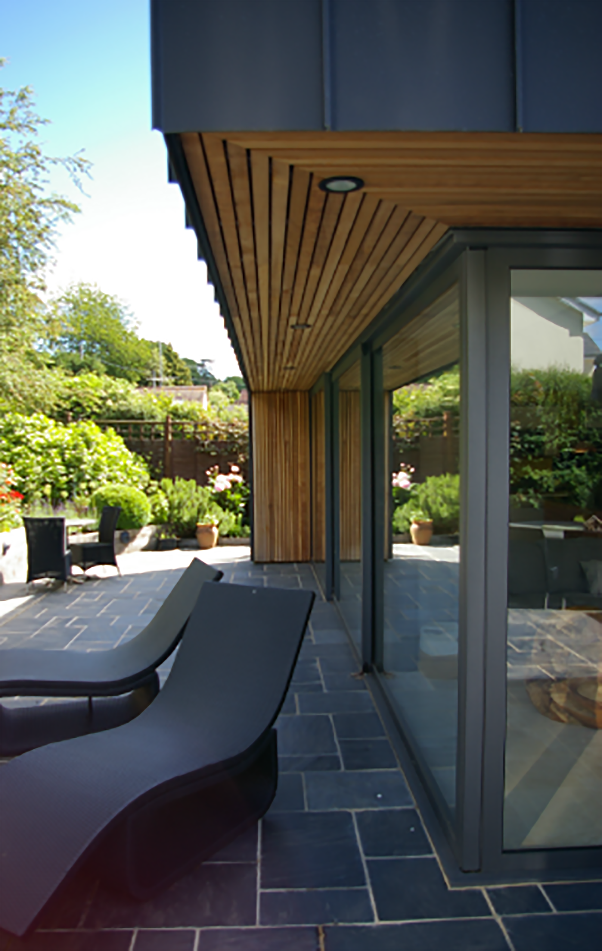 Under cedar cladding over hang
