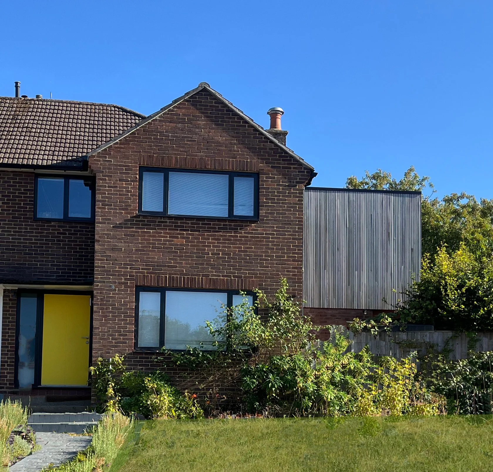 Wessex Drive front door and front elevation of extension including Cedar box extension. 