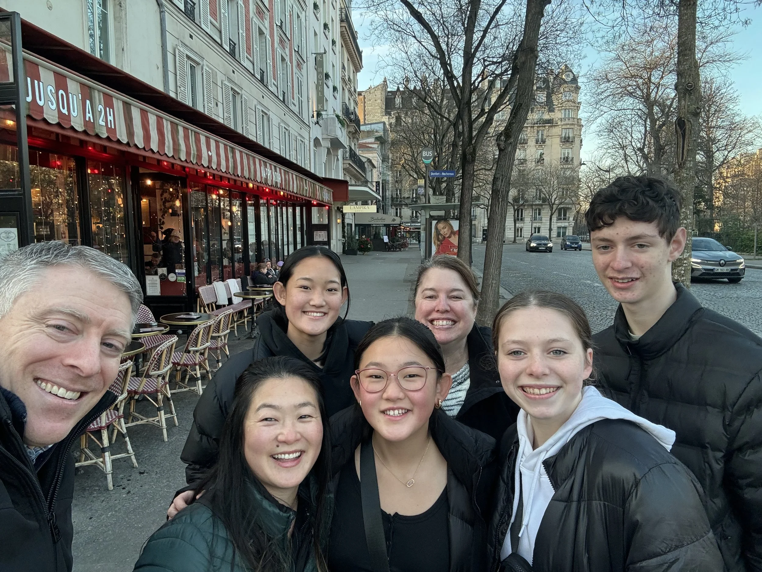 Parents and teenagers exploring Paris, France.