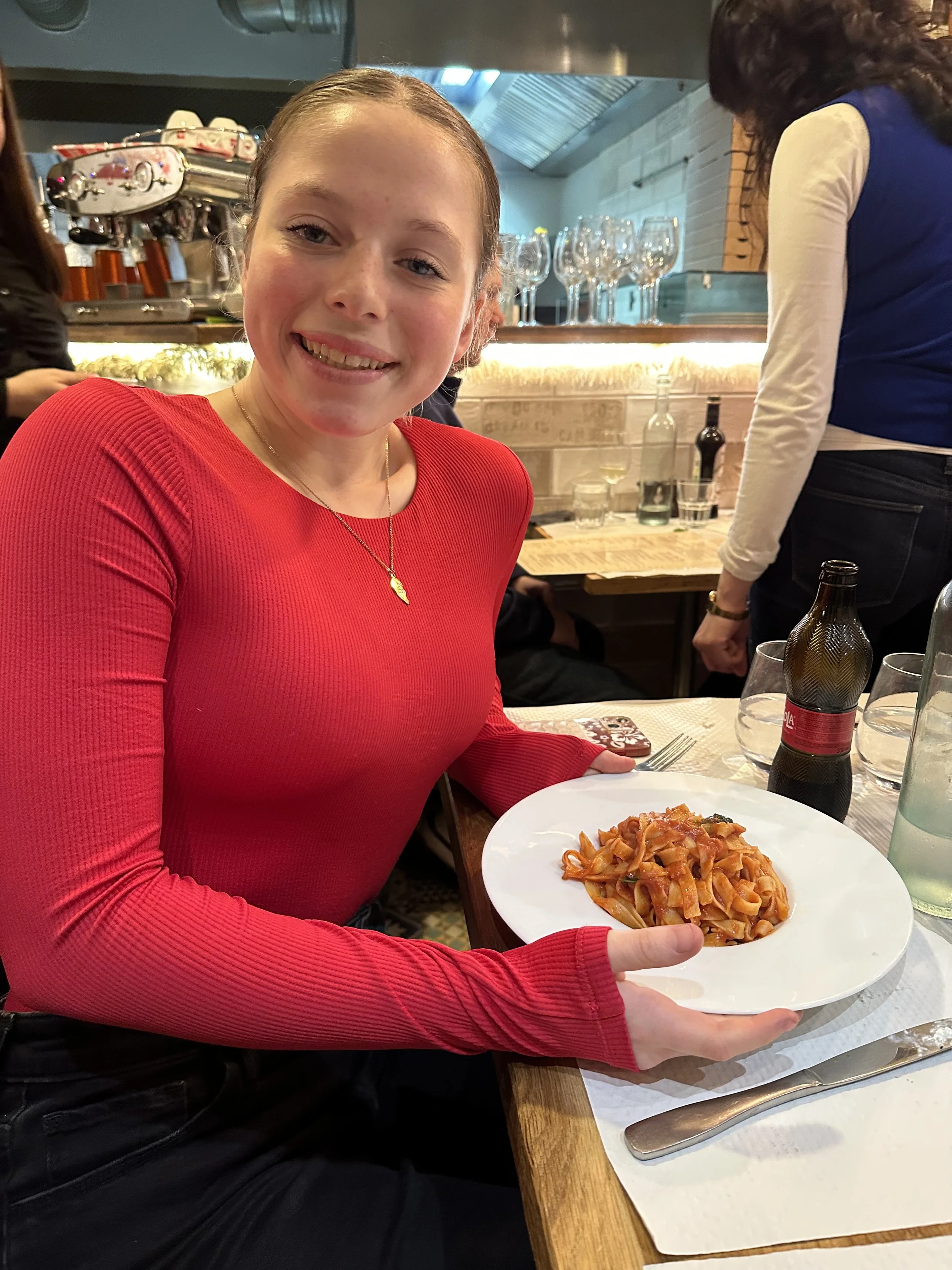 American teenage girl with Celiac Disease enjoying a 100% gluten-free meal at Tasca in Paris France.